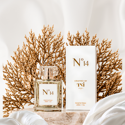 Perfume bottle and packaging with 'N 14' branding against a neutral background